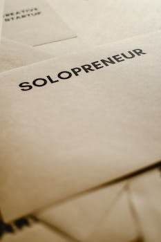 A close-up of an envelope labeled 'Solopreneur' on brown paper, symbolizing entrepreneurship.